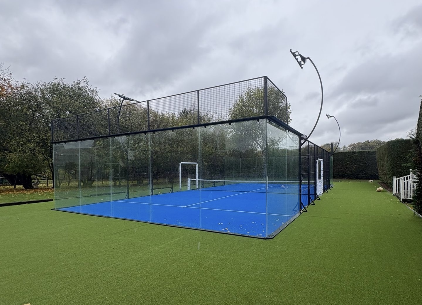 Glass padel court ready for league night