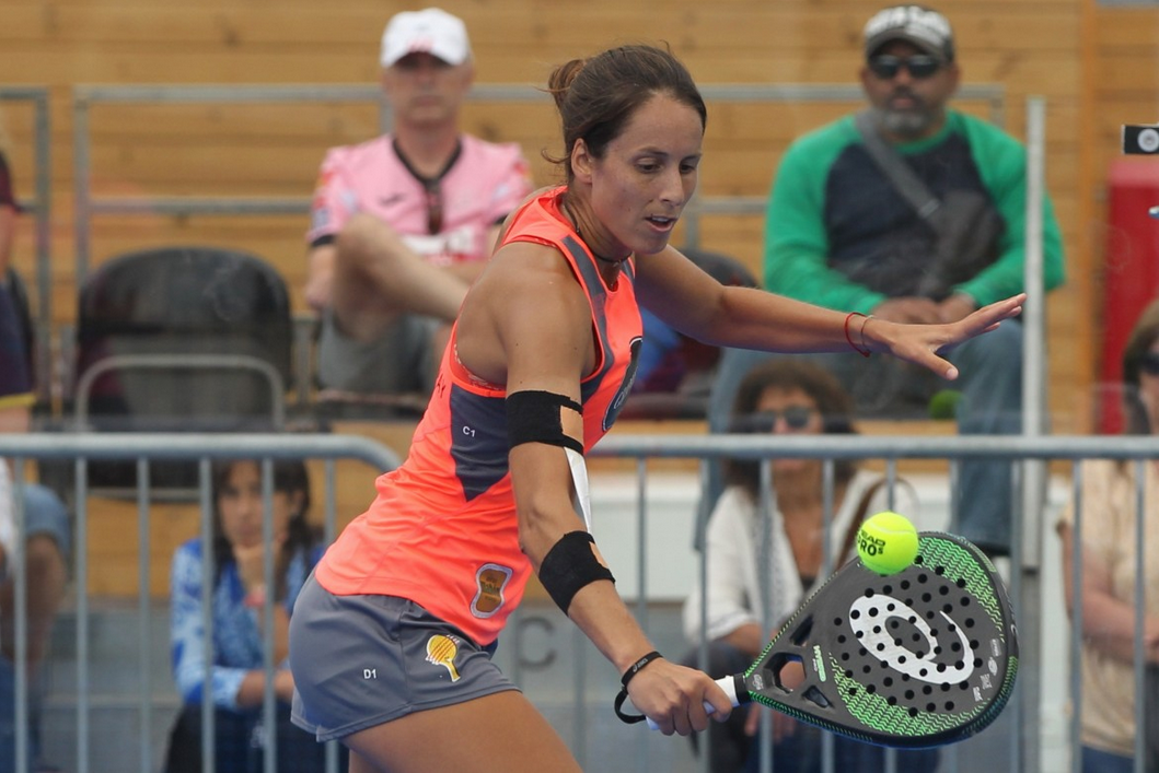 Padel player striking a volley in a custom club shirt